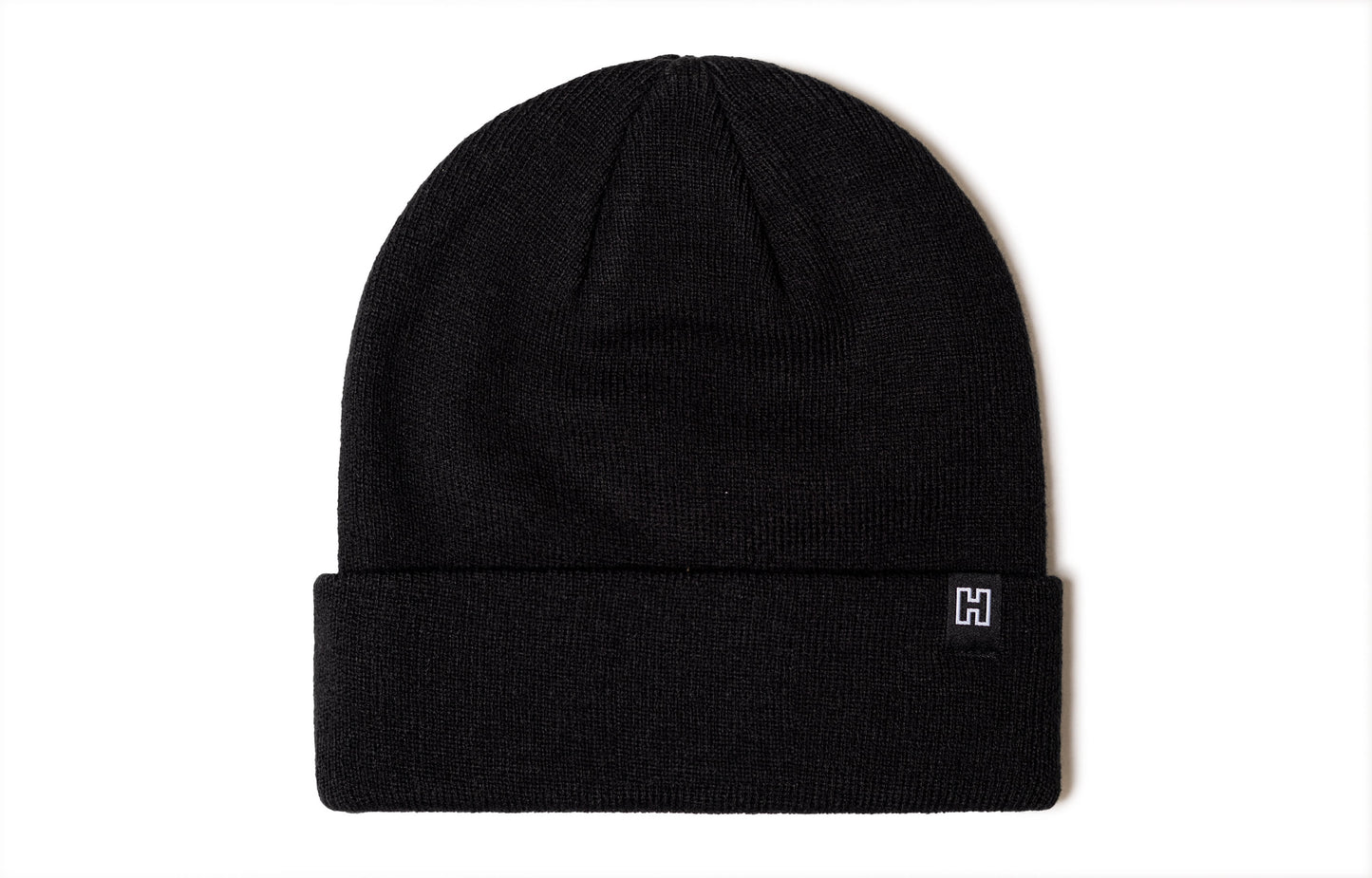 Black beanie viewed from the back side, no design.