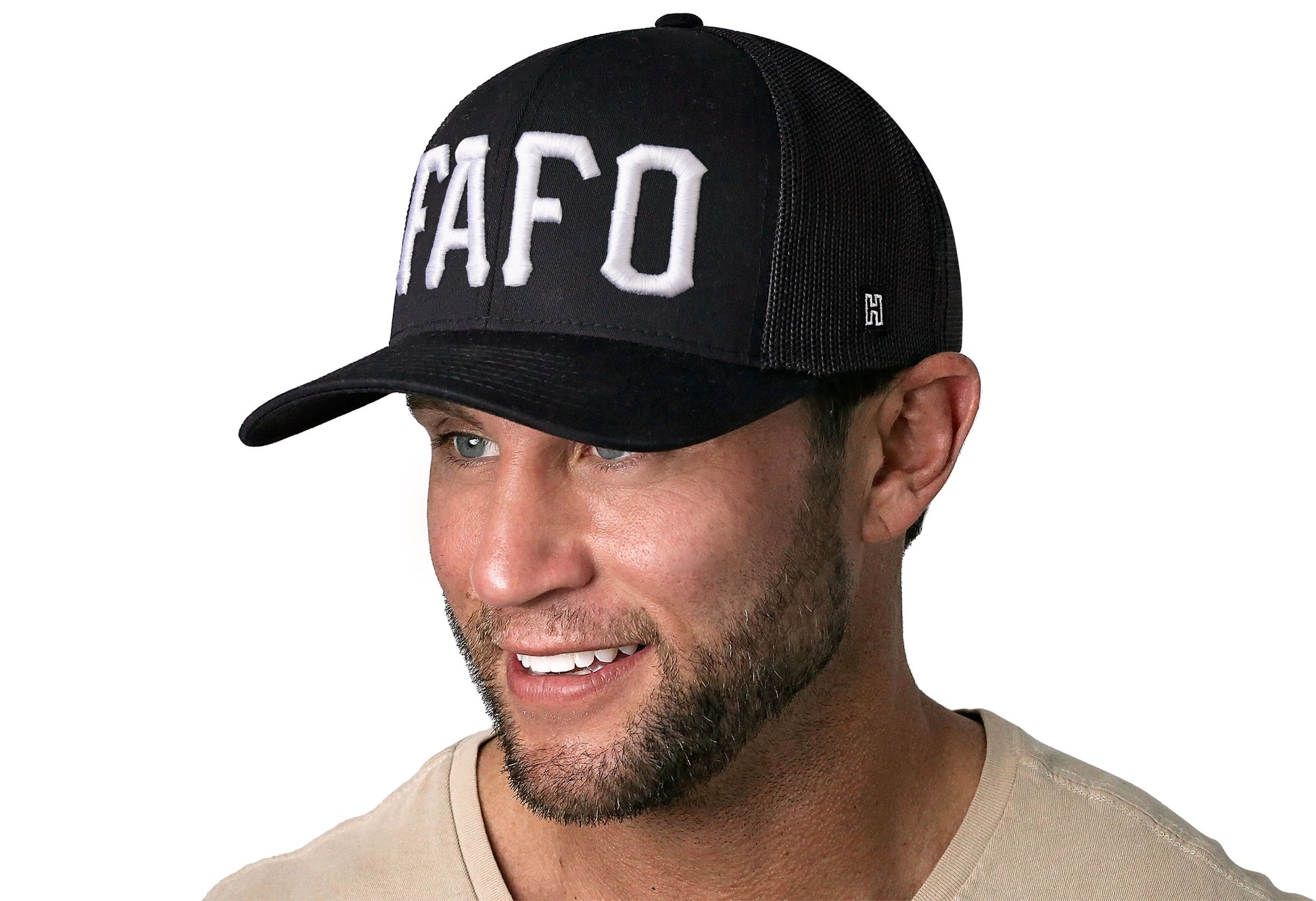black trucker hat worn by a male model viewed from the left side and features a White 'FAFO' Puff Embroidery 3D Embroidery displayed on the front panel. The hat has a classic mesh back design and a curved structured bill