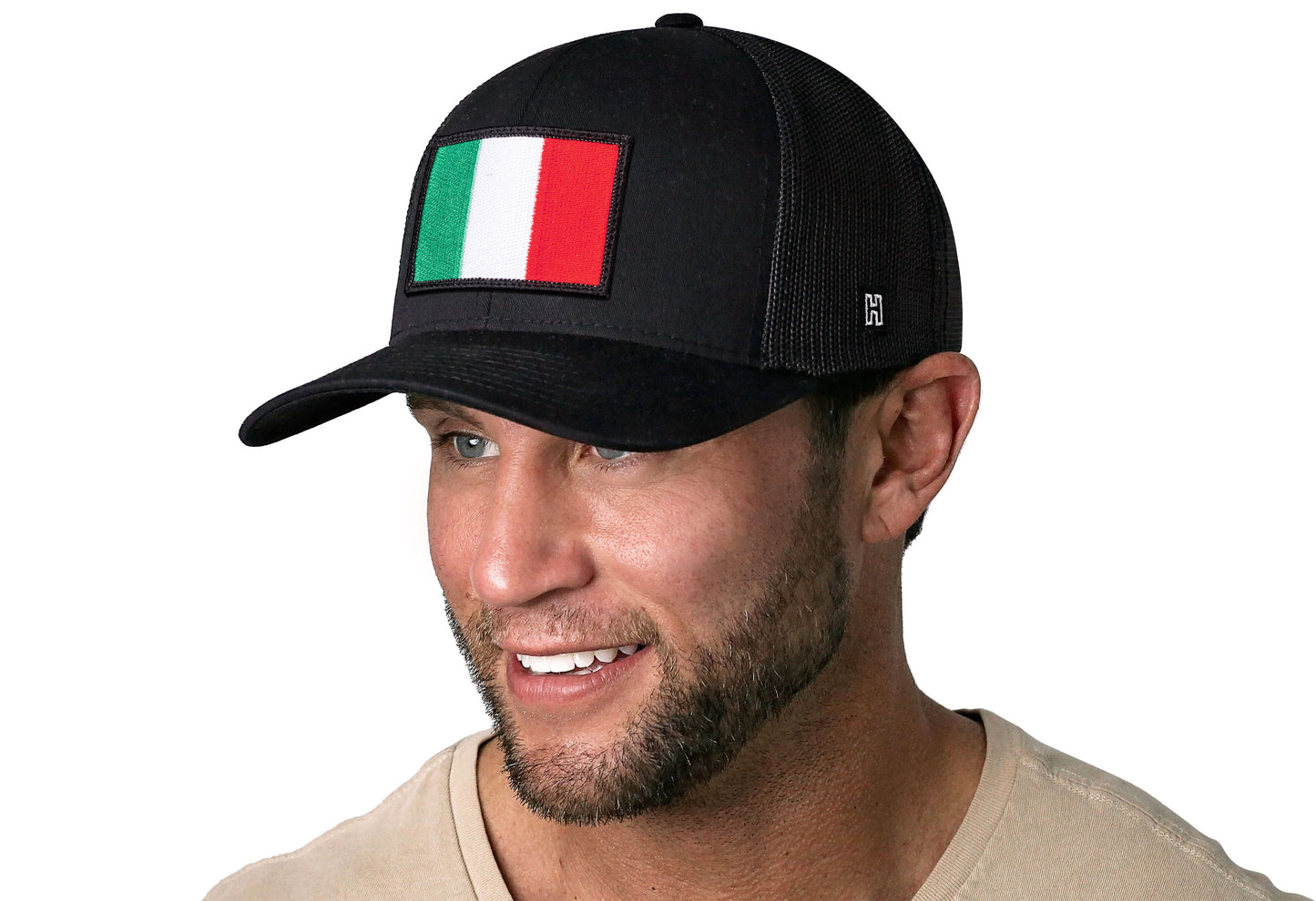 Black trucker hat worn by a male model viewed from the left side and features a Italian Flag Embroidered Rectangle Patch displayed on the front panel. The hat has a classic mesh back design and a curved structured bill