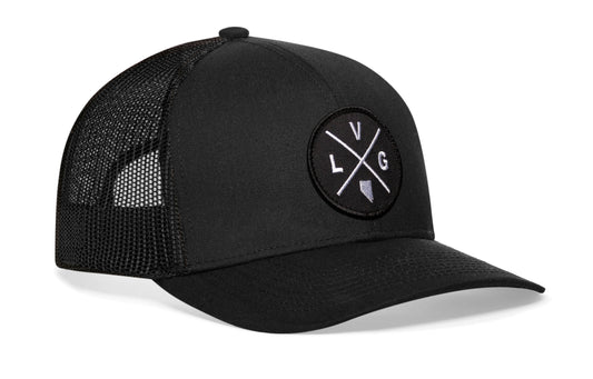 Black trucker hat viewed from the right side, showcasing a Las Vegas LVG X Embroidered Circle Patch prominently displayed on the front