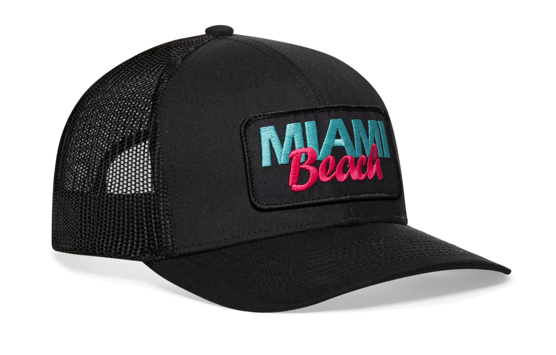 Black trucker hat viewed from the right side, showcasing a Miami Beach Embroidered Circle Patch prominently displayed on the front
