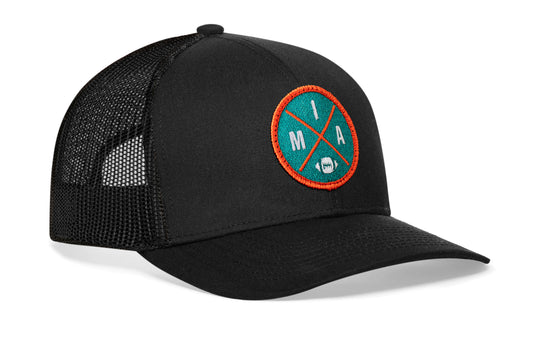 black trucker hat viewed from the right side, showcasing a MIA Football embroidered X patch in orange and blue prominently displayed on the front