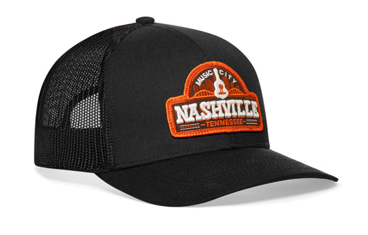 Black trucker hat viewed from the right side, showcasing a Nashville "Music City" Cityscape 3D Embroidery Cut-To-Shape prominently displayed on the front