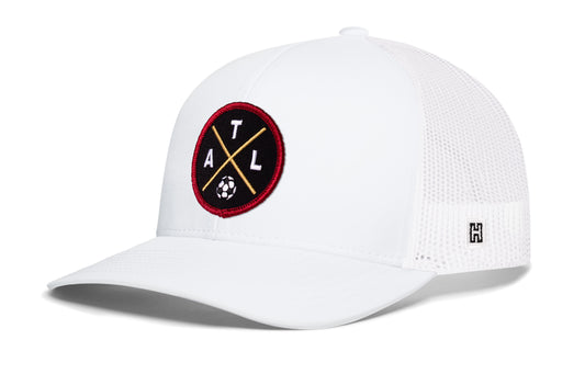 Atlanta Soccer Trucker Hat, white snapback showing Haka brandmark on left side of cap.