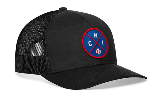 black trucker hat viewed from the right side, showcasing a royal and red baseball embroidered X patch prominently displayed on the front