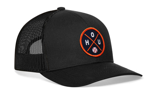 black trucker hat viewed from the right side, showcasing a navy and orange baseball embroidered X patch prominently displayed on the front