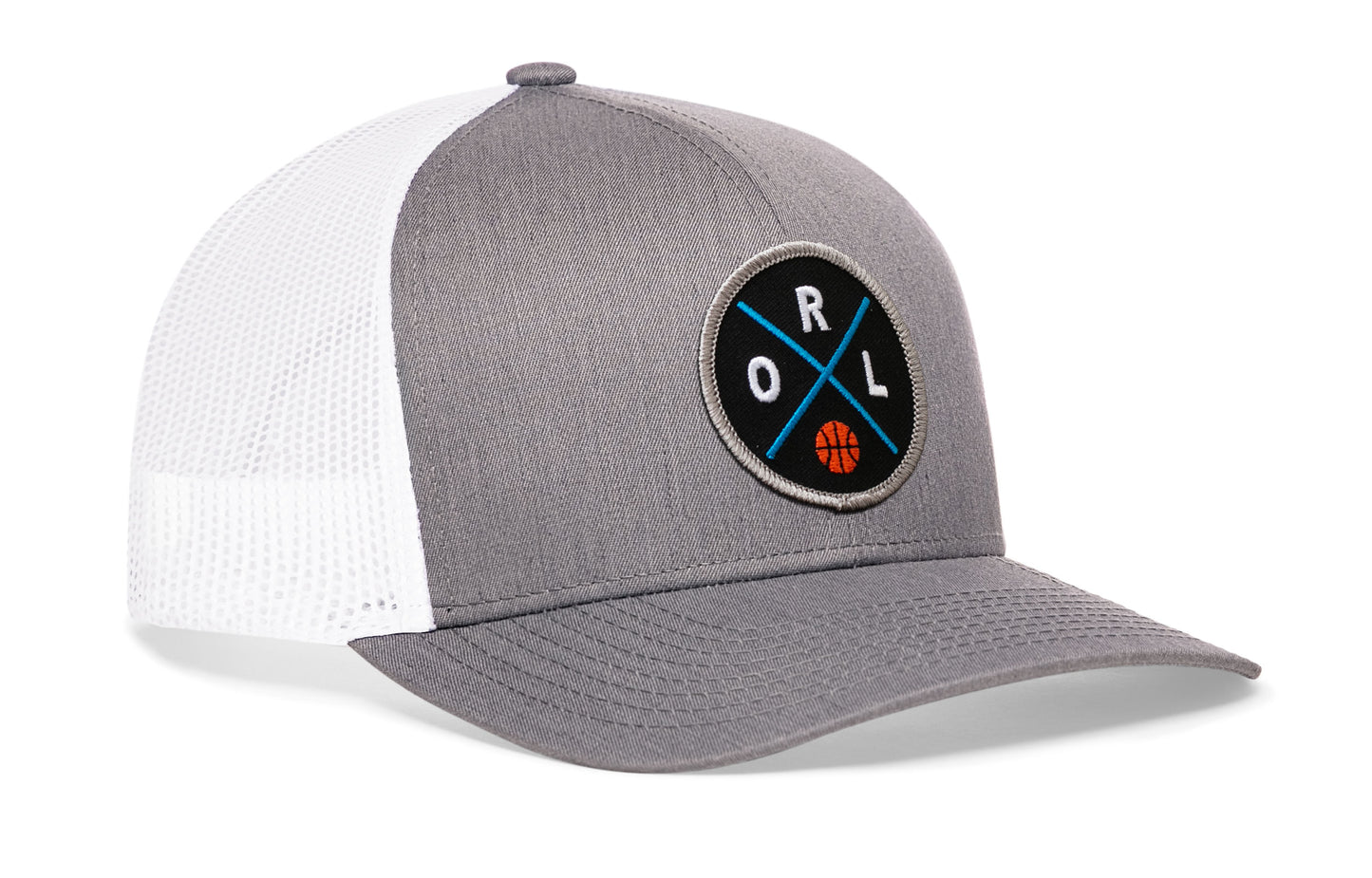 gray-white trucker hat viewed from the right side, showcasing a bold black, columbia blue and gray embroidered X patch prominently displayed on the front