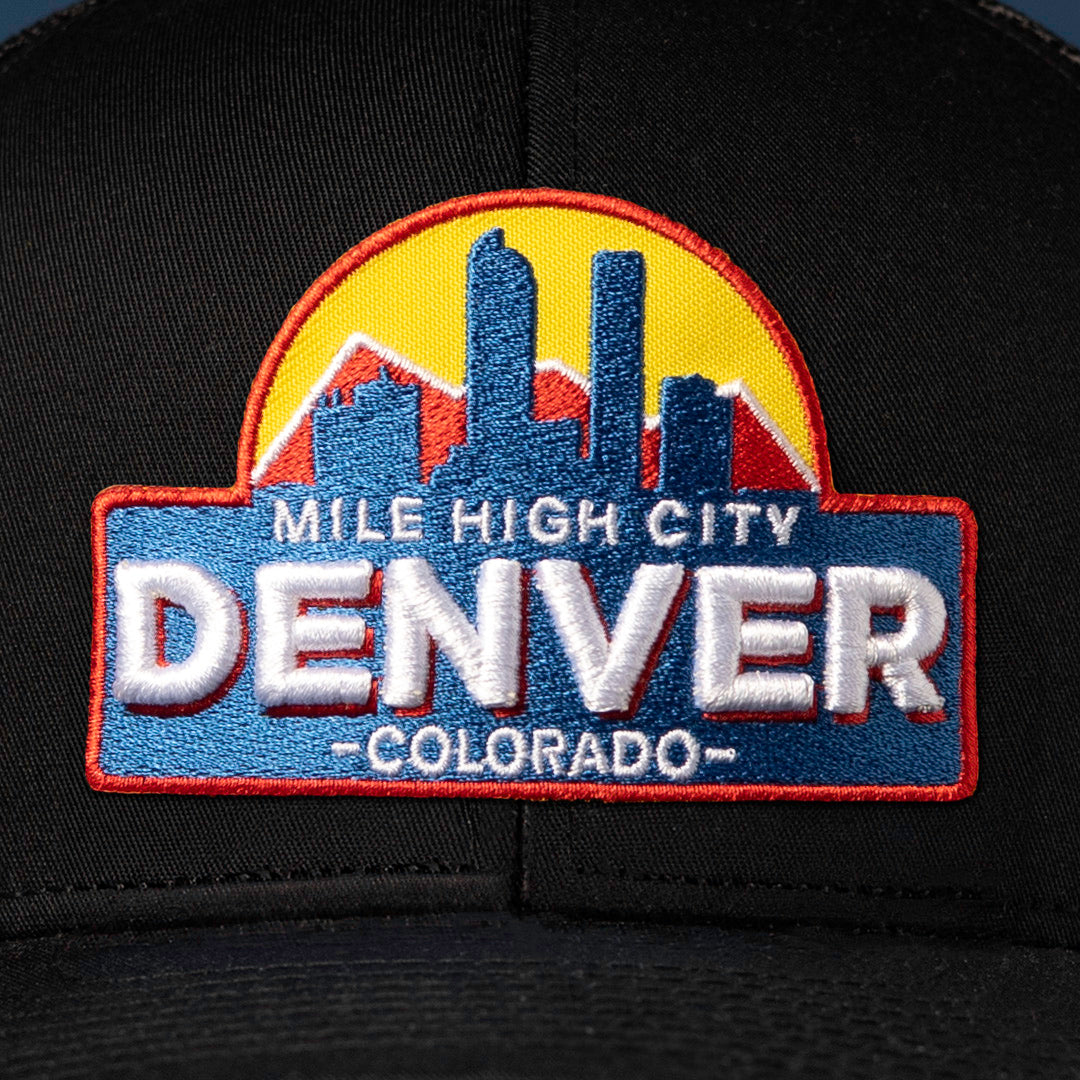 Up close embroidery detail showcasing a Denver Cityscape Embroidered Patch prominently displayed on the front