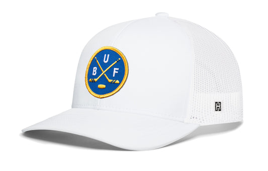 Buffalo hockey trucker hat, white snapback showing Haka brandmark on left side mesh of cap.
Rep Buffalo hockey.