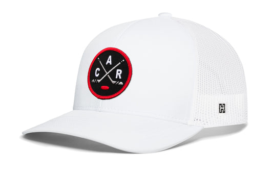 Carolina hockey trucker hat, white snapback showing Haka brandmark on left side mesh of cap.
Rep Carolina hockey.