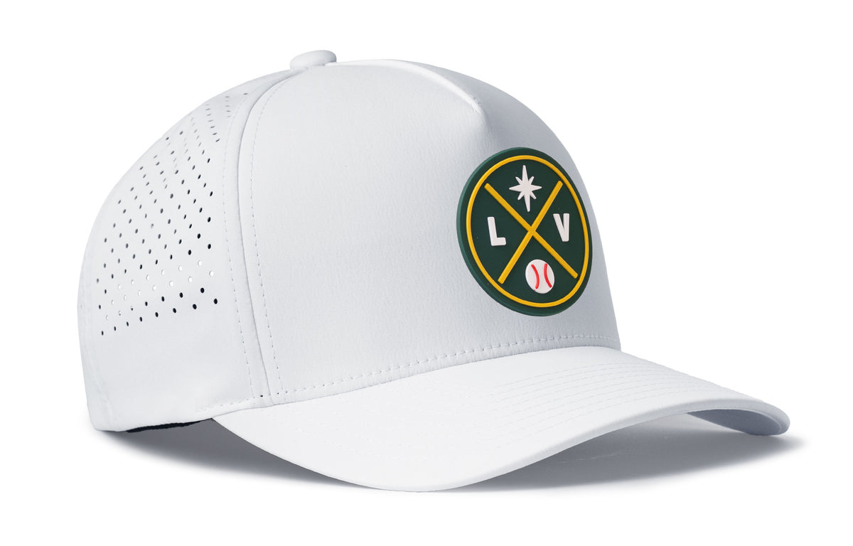 white performance 5-panel hat viewed from the right side, showcasing a bold green and gold pvc patch prominently displayed on the front