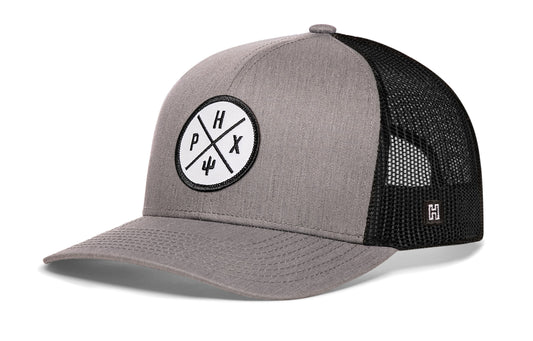 Phoenix Trucker Hat, gray-black snapback showing Haka brandmark on left side of cap.