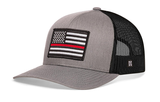 Thin Red Line Trucker Hat, gray-black snapback showing Haka brandmark on left side of cap.