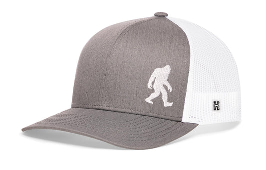 Haka Bigfoot Trucker Hat, Gray-White snapback for wilderness explorers. Fans of Big Foot and other cryptoid.