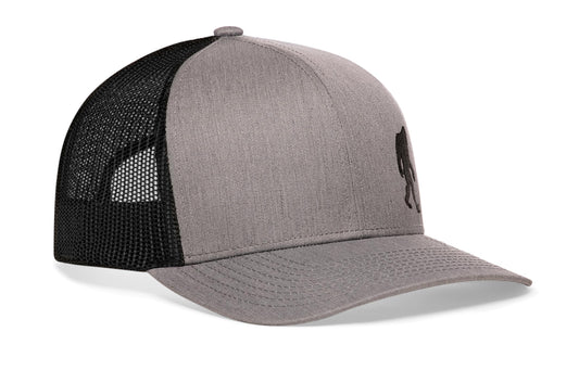 Gray-Black trucker hat viewed from the right side, showcasing a Bigfoot Gray-Black Sasquatch Flat Embroidery prominently displayed on the front