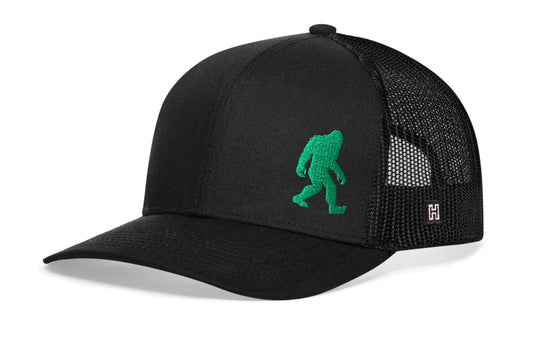 Haka Green Bigfoot Trucker Hat, Black snapback for wilderness explorers. Fans of Big Foot and other cryptoid.