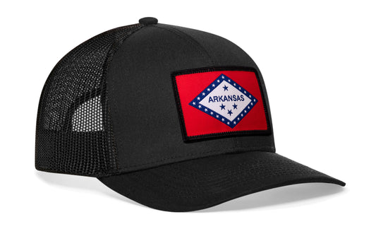 Black trucker hat viewed from the right side, showcasing a Arkansas Flag Embroidered Rectangle Patch prominently displayed on the front
