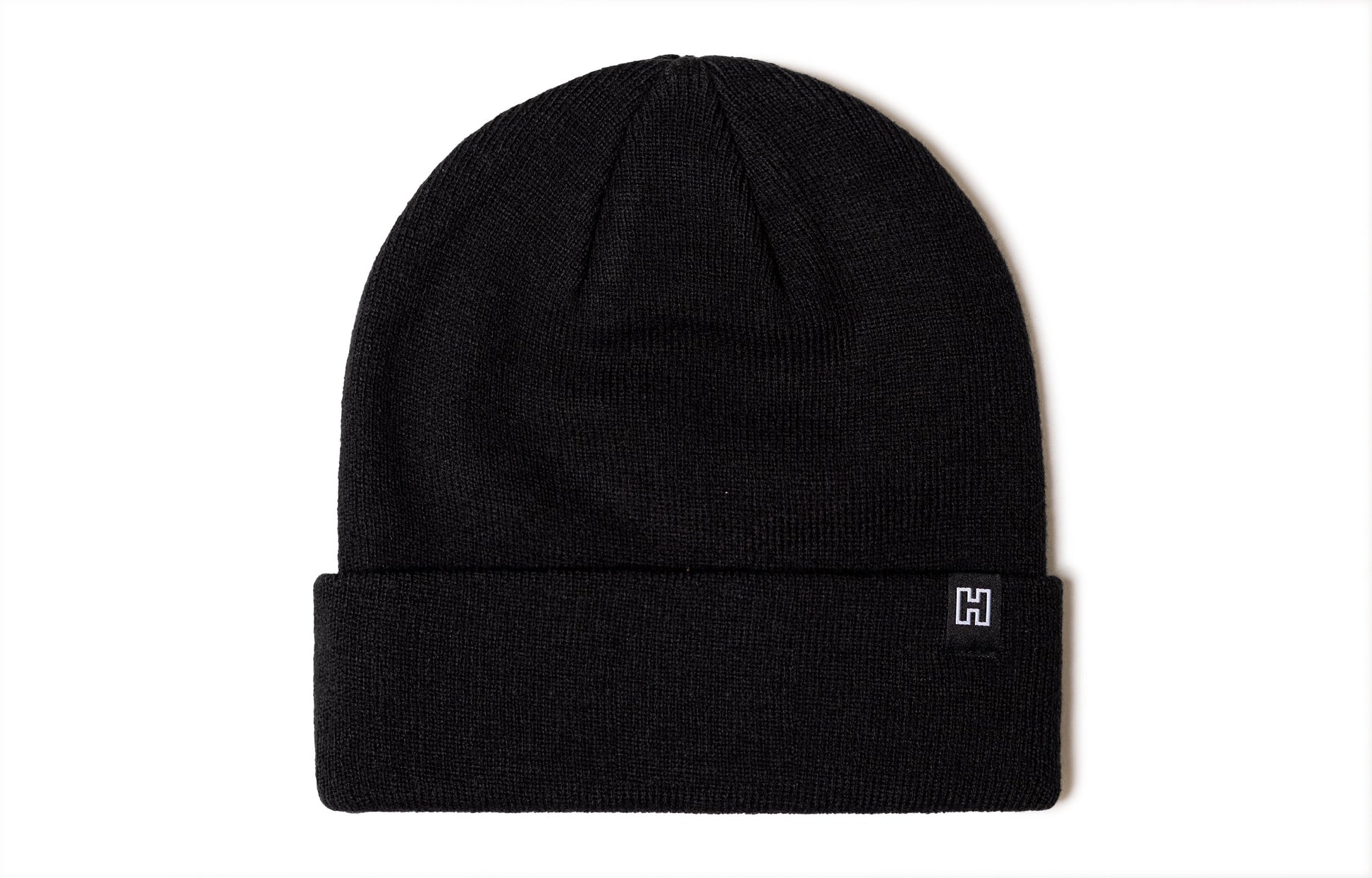 Black beanie viewed from the back side, no design.