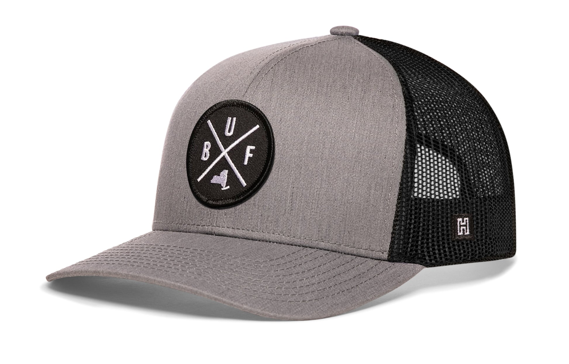 Buffalo Trucker Hat, gray-black snapback showing Haka brandmark on left side mesh.
Rep Buffalo, NY.