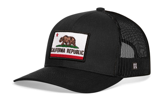 California Flag Trucker Hat, black snapback showing Haka brandmark on left side of cap.