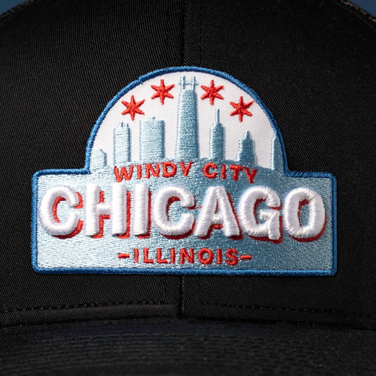 Detailed view of embroidery on Chicago Cityscape Embroidered Patch prominently displayed on the front of hat
