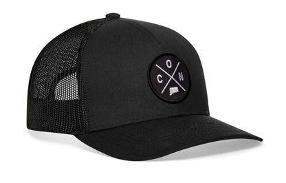 Black trucker hat viewed from the right side, showcasing a Connecticut CON X Embroidered Circle Patch prominently displayed on the front