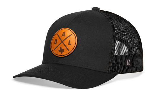Dallas Trucker Hat Leather, black snapback showing Haka brandmark on left side mesh.
Rep Dallas, TX.