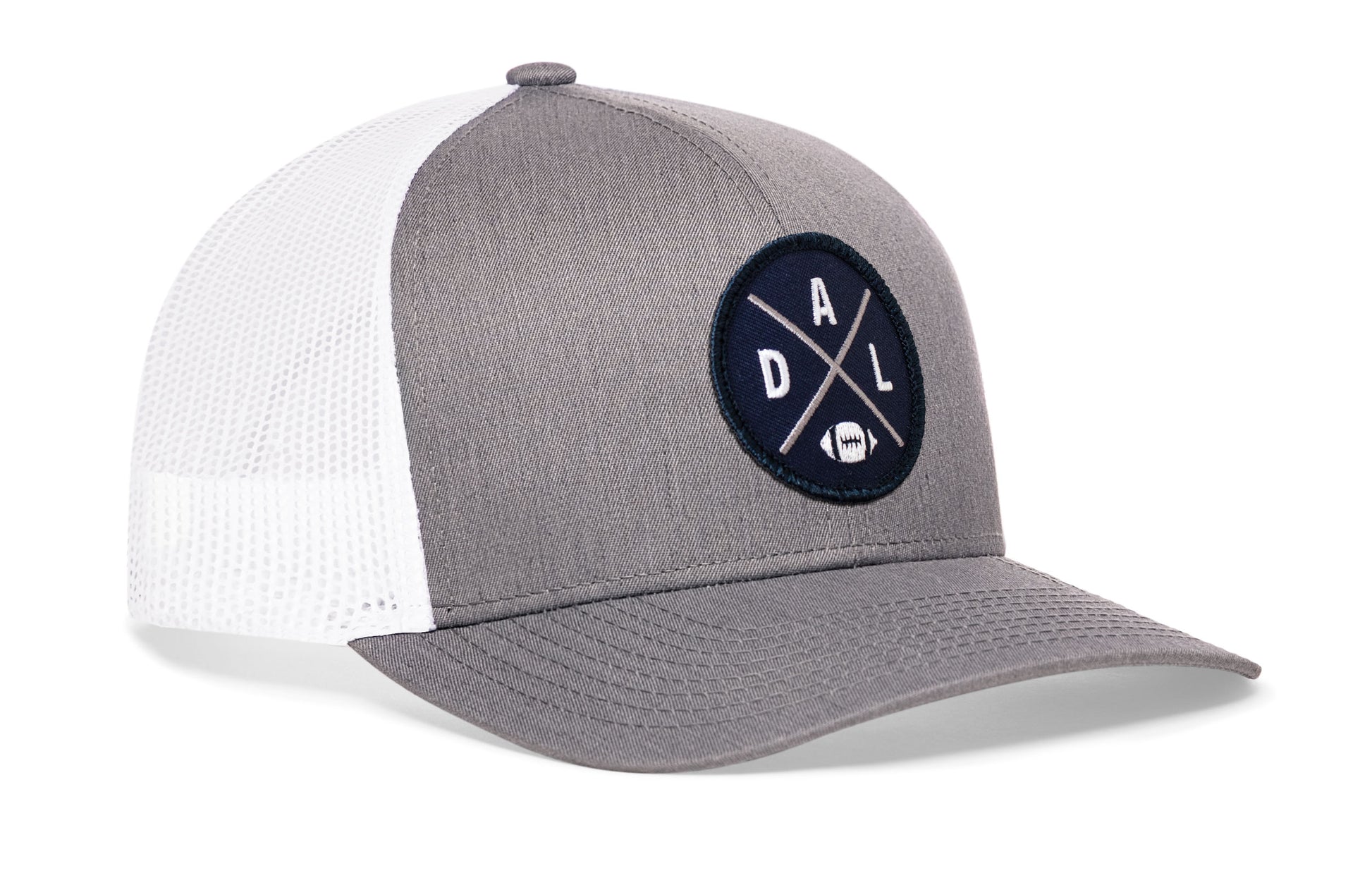 gray-white trucker hat viewed from the right side, showcasing a DAL Football embroidered X patch in navy, silver, and white prominently displayed on the front