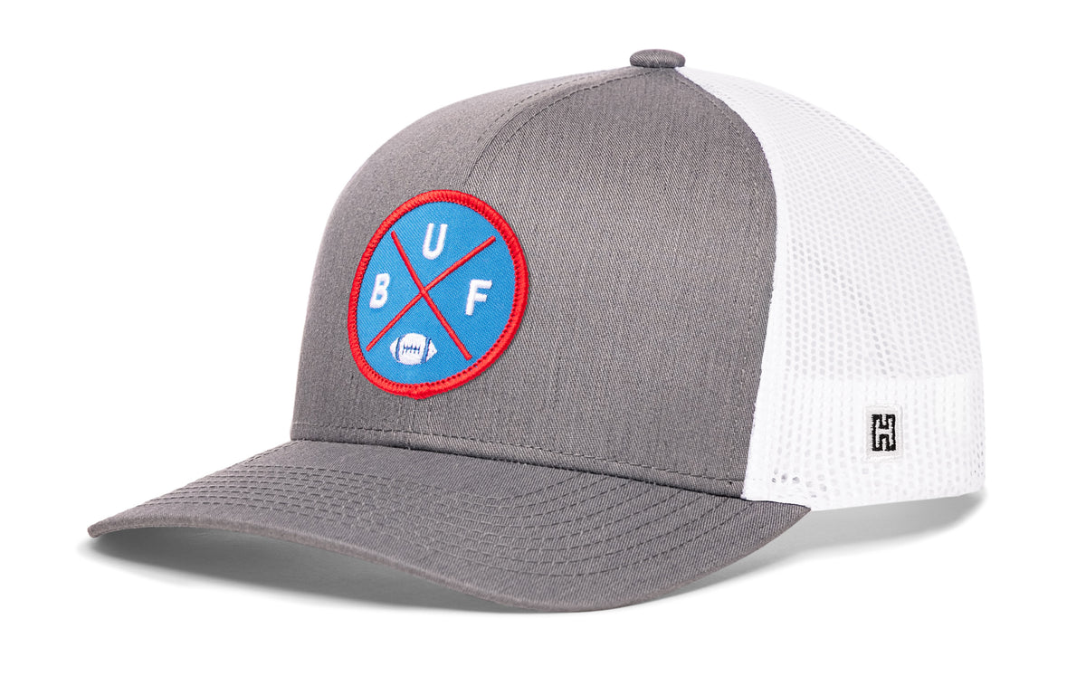 Buffalo Football Trucker Hat, gray-white snapback showing Haka brandmark on left side of cap.