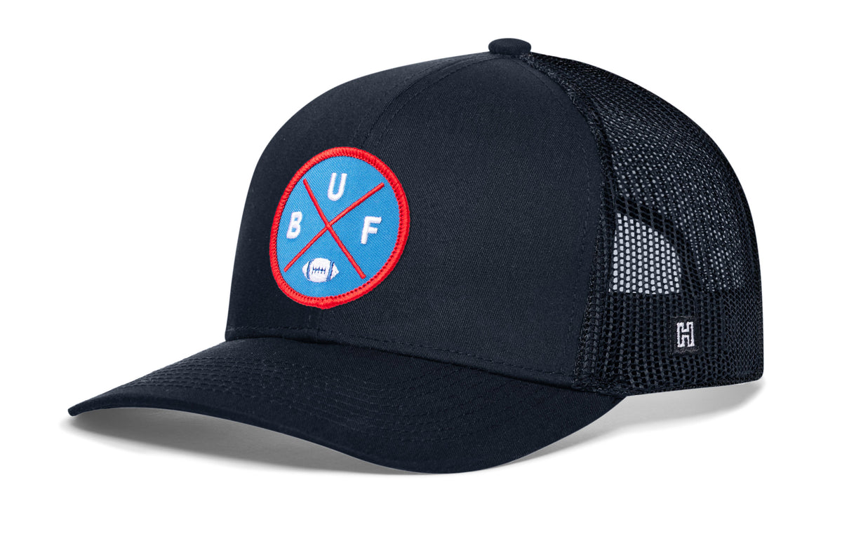 Buffalo Football Trucker Hat, navy snapback showing Haka brandmark on left side of cap.