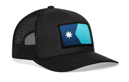 Black trucker hat viewed from the right side, showcasing a Minnesota Flag Embroidered Rectangle Patch prominently displayed on the front
