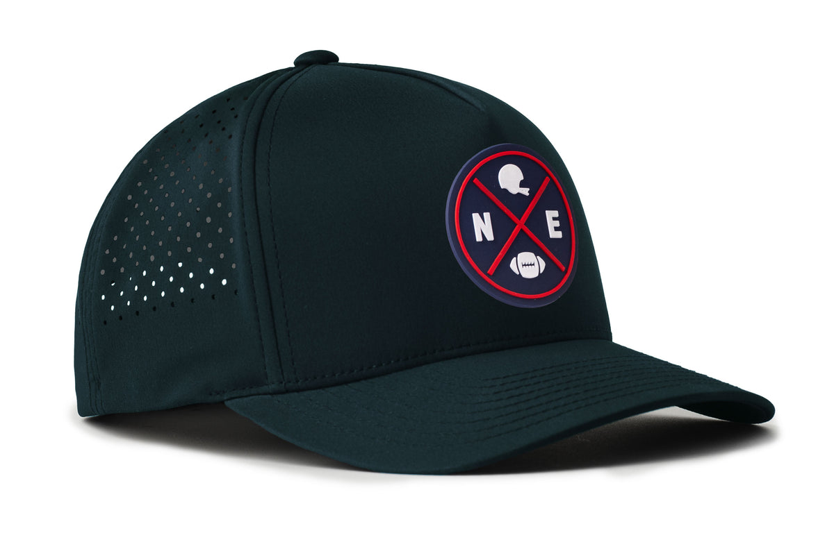 navy performance 5-panel hat viewed from the right side, showcasing a bold navy and red pvc patch prominently displayed on the front