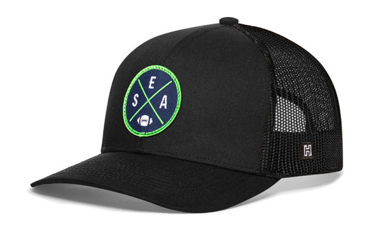 Haka Seattle trucker hat, black snapback, viewed from the left side. Represent Seattle football.