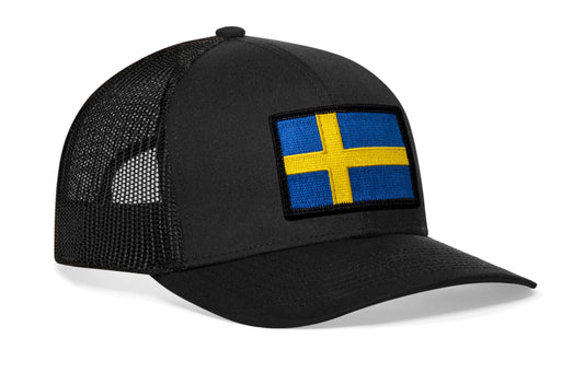 Black trucker hat viewed from the right side, showcasing a Swedish Flag Embroidered Rectangle Patch prominently displayed on the front