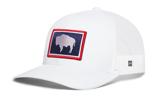 Wyoming Flag Trucker Hat, white snapback showing Haka brandmark on left side of cap.
