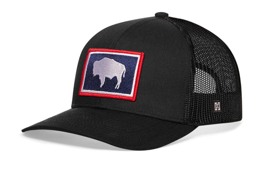 Wyoming Flag Trucker Hat, black snapback showing Haka brandmark on left side of cap.