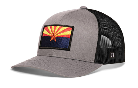 Arizona Flag Trucker Hat, gray-black snapback showing Haka brandmark on left side of cap.
