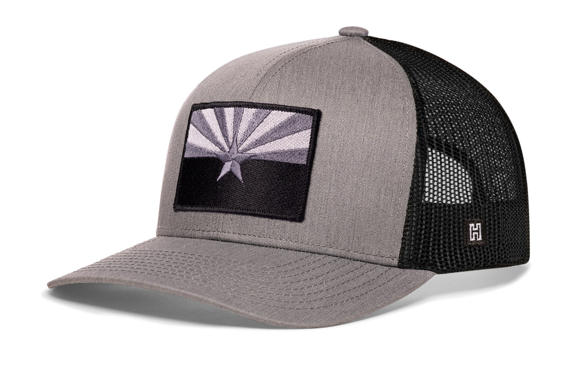 Arizona Flag Trucker Hat, gray-black snapback showing Haka brandmark on left side of cap.