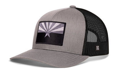 Arizona Flag Trucker Hat, gray-black snapback showing Haka brandmark on left side of cap.