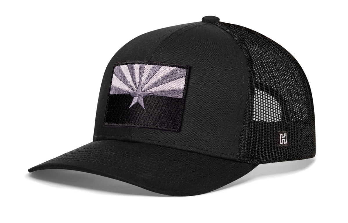 Arizona Flag Trucker Hat, black snapback showing Haka brandmark on left side of cap.