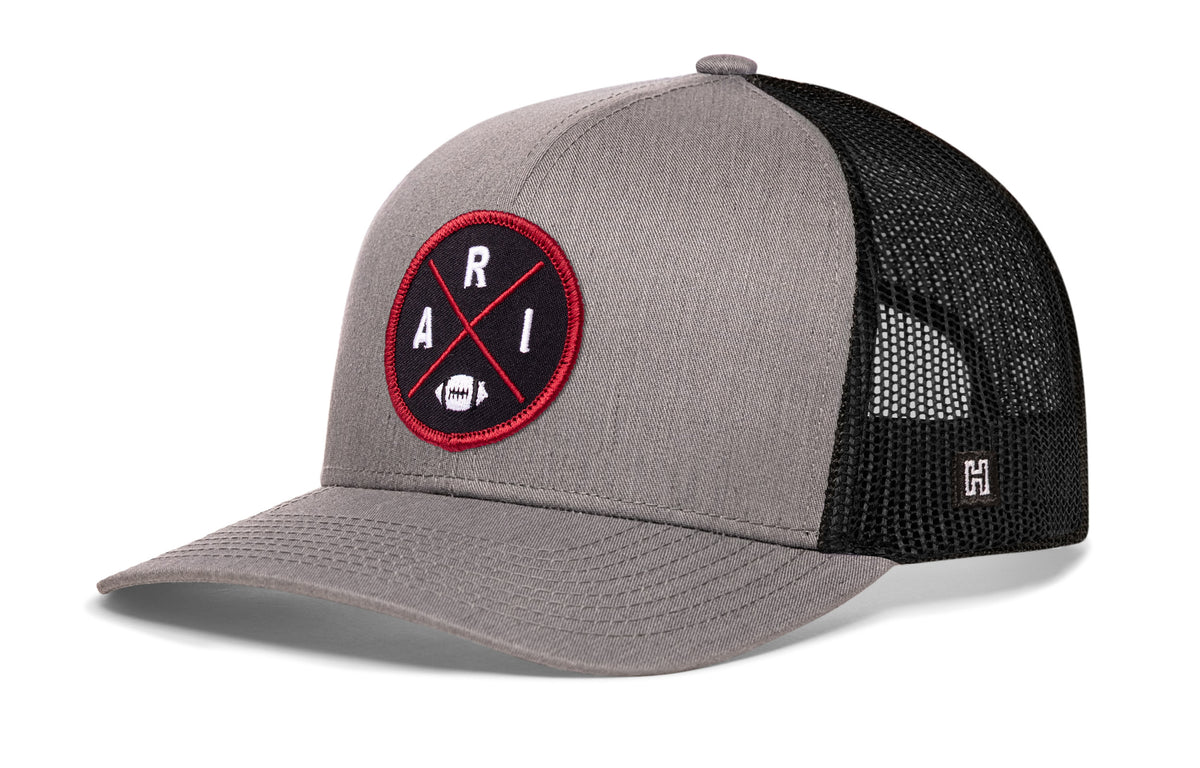 Arizona Football Trucker Hat, gray-black snapback showing Haka brandmark on left side of cap.