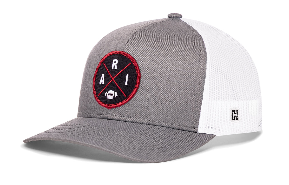 Arizona Football Trucker Hat, gray-white snapback showing Haka brandmark on left side of cap.