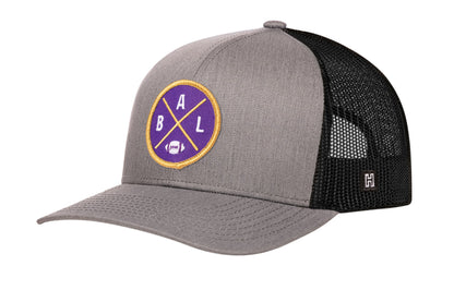 Baltimore Football Trucker Hat, gray-black snapback showing Haka brandmark on left side of cap.