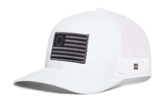 Betsy Ross Flag Trucker Hat, white snapback showing Haka brandmark on left side of cap.