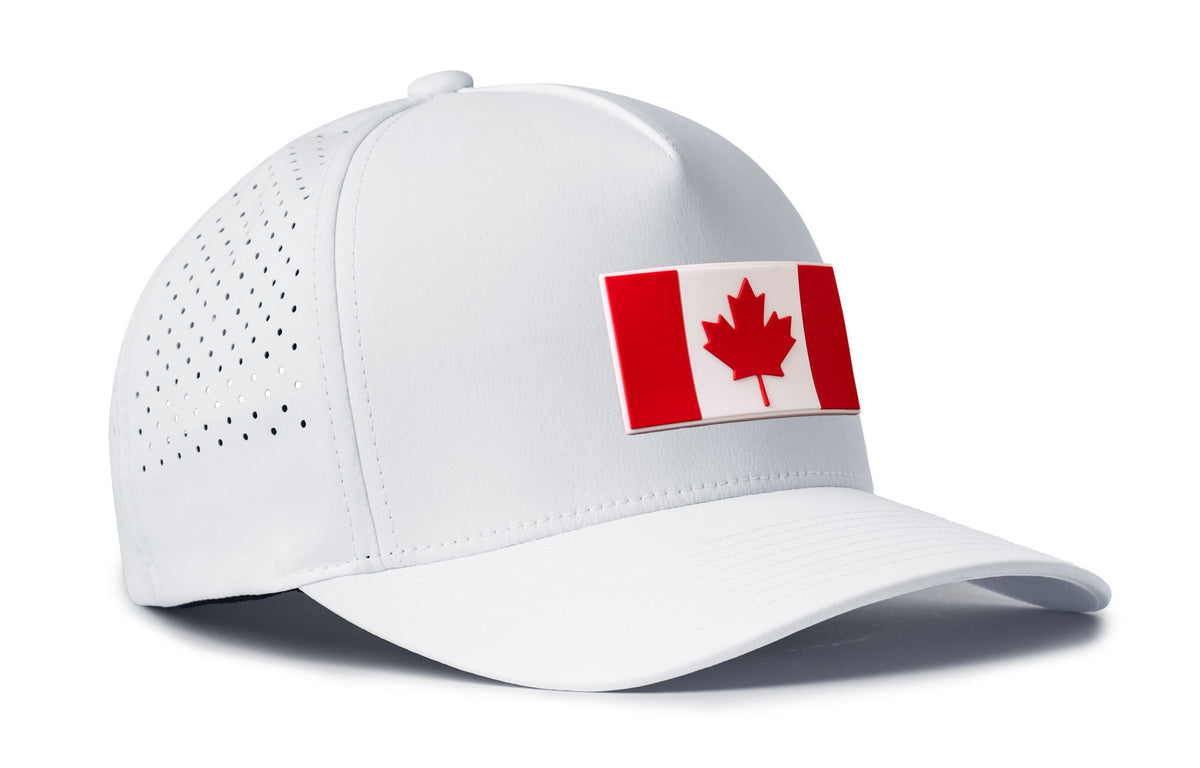 white performance 5-panel hat viewed from the right side, showcasing a bold red and white pvc patch prominently displayed on the front