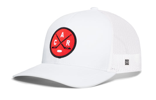 Carolina Hockey Trucker Hat, white snapback showing Haka brandmark on left side of cap.