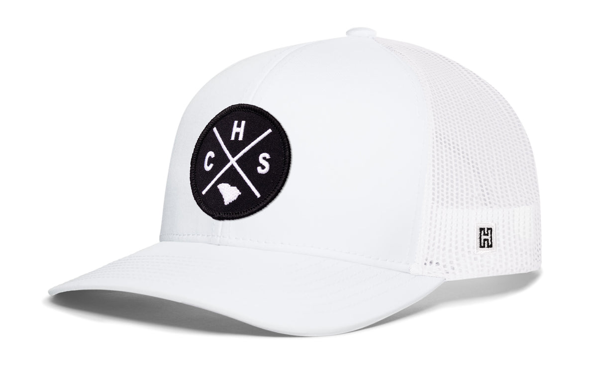 Charleston Trucker Hat, white snapback showing Haka brandmark on left side of cap.