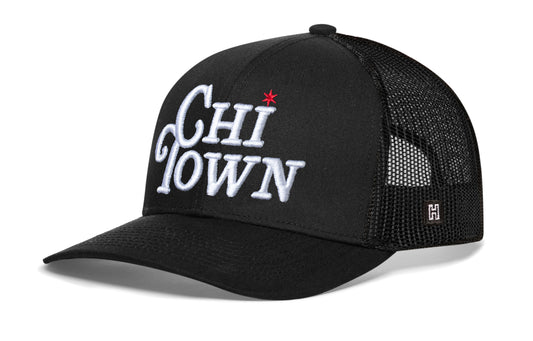 CHI-Town Trucker Hat, black snapback showing Haka brandmark on left side of cap.