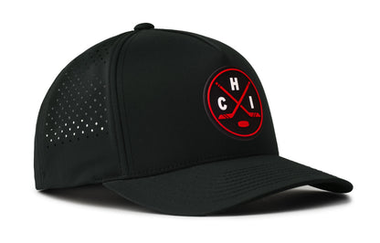 black performance 5-panel hat viewed from the right side, showcasing a bold black and red pvc patch prominently displayed on the front
