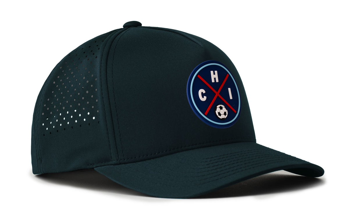navy performance 5-panel hat viewed from the right side, showcasing a bold red and blue pvc patch prominently displayed on the front